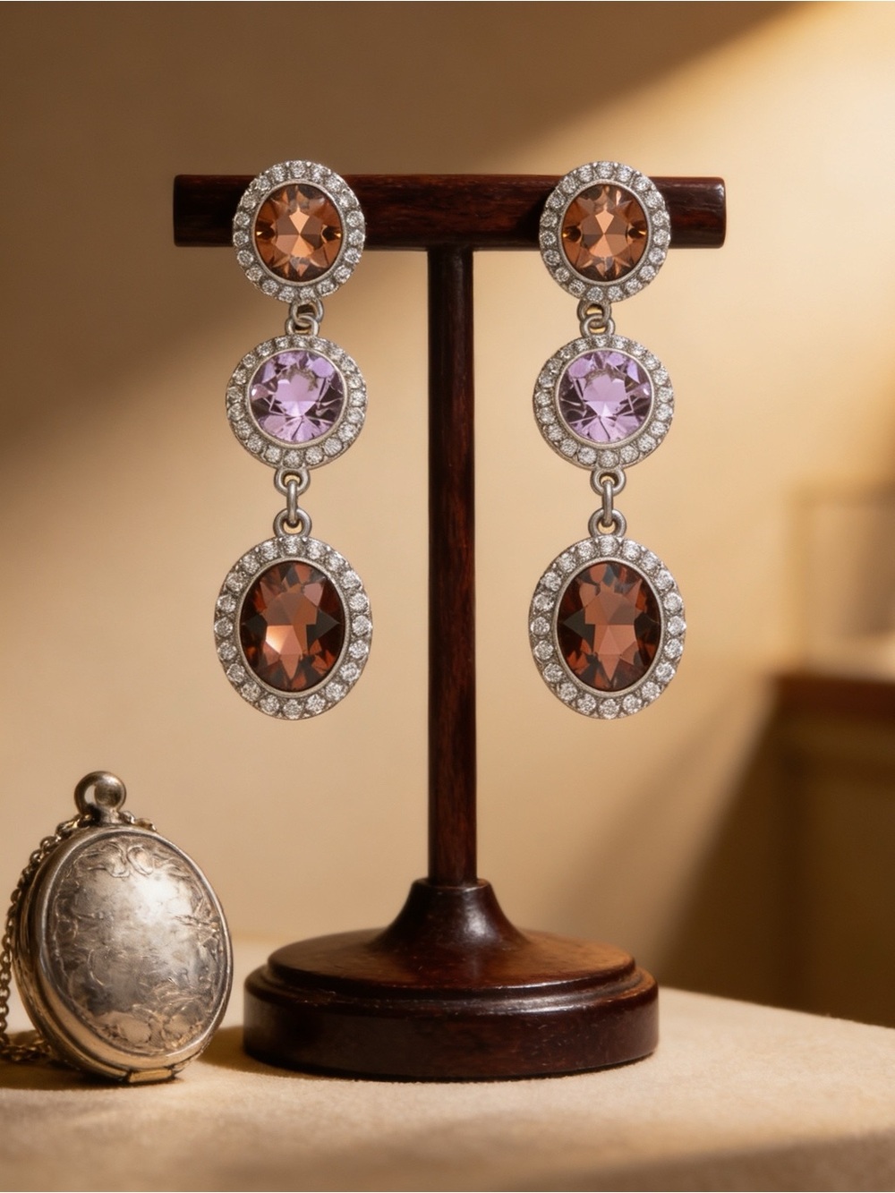 Elegant 3-tier drop earrings with a secure post-back closure.